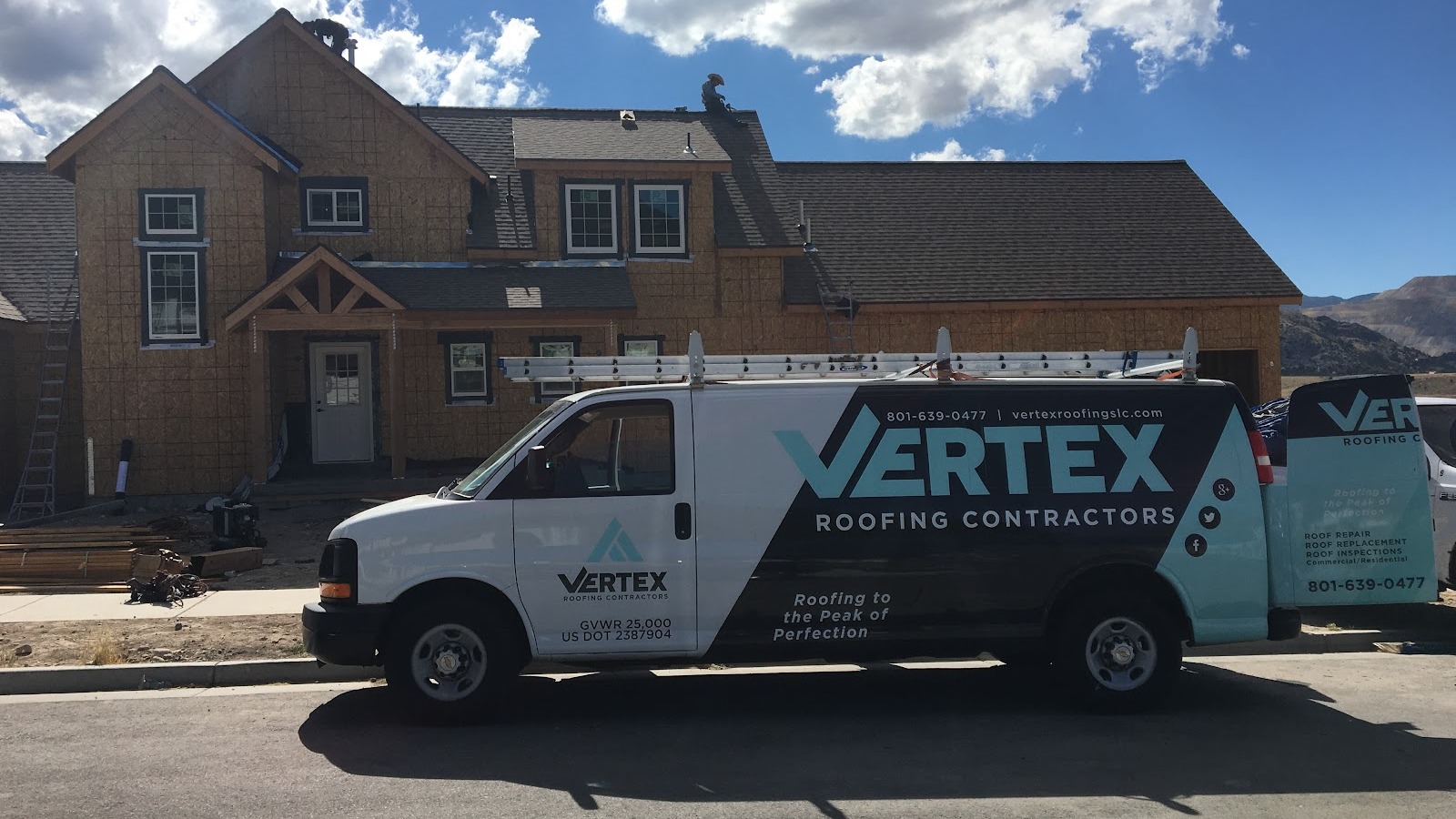 A Vertex Roofing Contractors van is parked in front of a house under construction in South Salt Lake, Utah, on a sunny day—demonstrating their commitment to delivering top-quality roofing solutions.