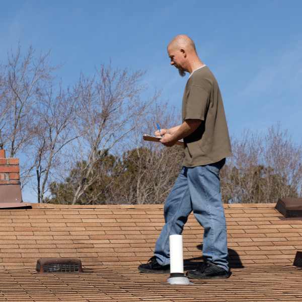Roof damage inspection with homeowner and insurance agent
