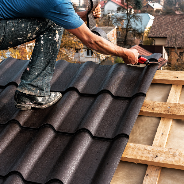 Roofing team installing a new roof with clean site prep
